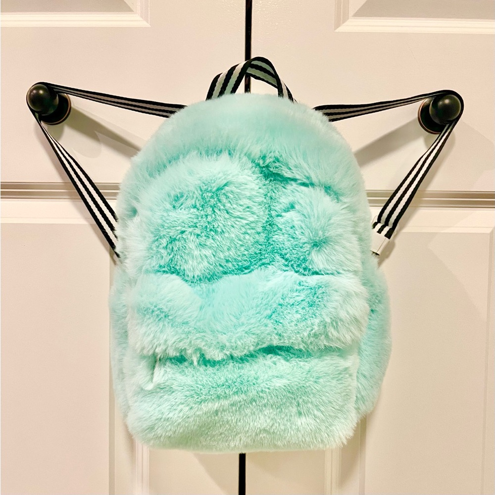 Little girls fluffy teal backpack. 12x10x8. Zipper pouch on front. Drink holder